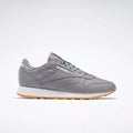 A pair of Reebok Classic Leather Shoes featuring a gray leather upper, white and gum sole, gray laces, and the Reebok logo on the side, shown on a plain white background.