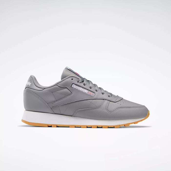 A pair of Reebok Classic Leather Shoes featuring a gray leather upper, white and gum sole, gray laces, and the Reebok logo on the side, shown on a plain white background.