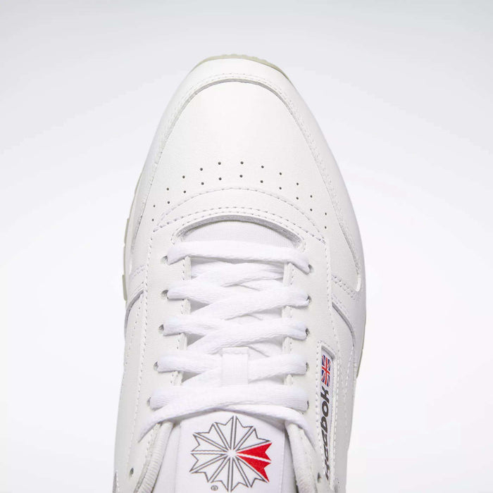 Top view of Reebok Classic Leather Shoes in white, retro style with durable leather, white laces, toe perforations, and the Reebok logo with British flag on the side and tongue against a light background.