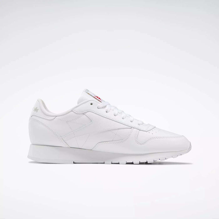 The Reebok Classic Leather Shoes are white low-top sneakers inspired by retro designs, with white laces and subtle branding, shown against a simple light background.
