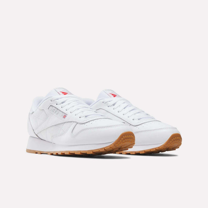 A pair of Reebok Classic Leather Shoes with gum rubber soles, white laces, and subtle side and tongue branding, shown on a plain white background.
