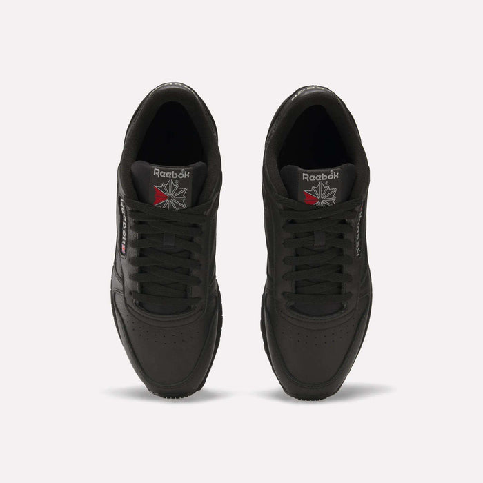 Top view of Reebok Classic Leather Shoes in black, featuring a durable leather upper and iconic Reebok logos on the tongue and side, displayed against a plain white background.