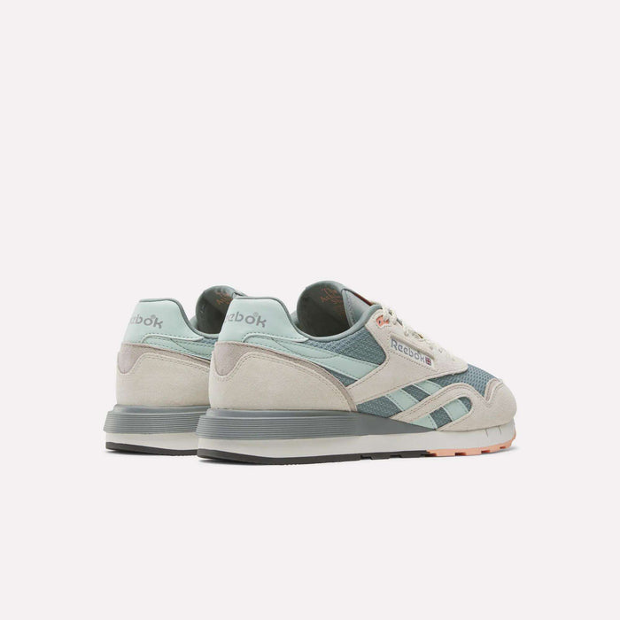 A pair of Reebok Classic Nylon 89 Shoes in light blue, gray, and white with a cushioned midsole, displayed from the back and side on a plain white background.