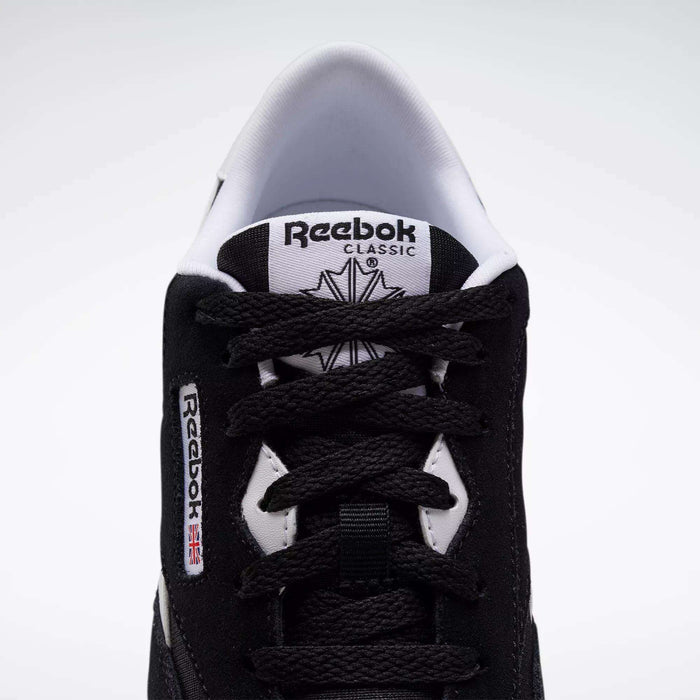 Top view of Reebok Classic Nylon Shoes - Big Kids, in black with white accents, minimalist 80s-inspired design, visible laces, branded tongue, and side label featuring a small Union Jack flag.