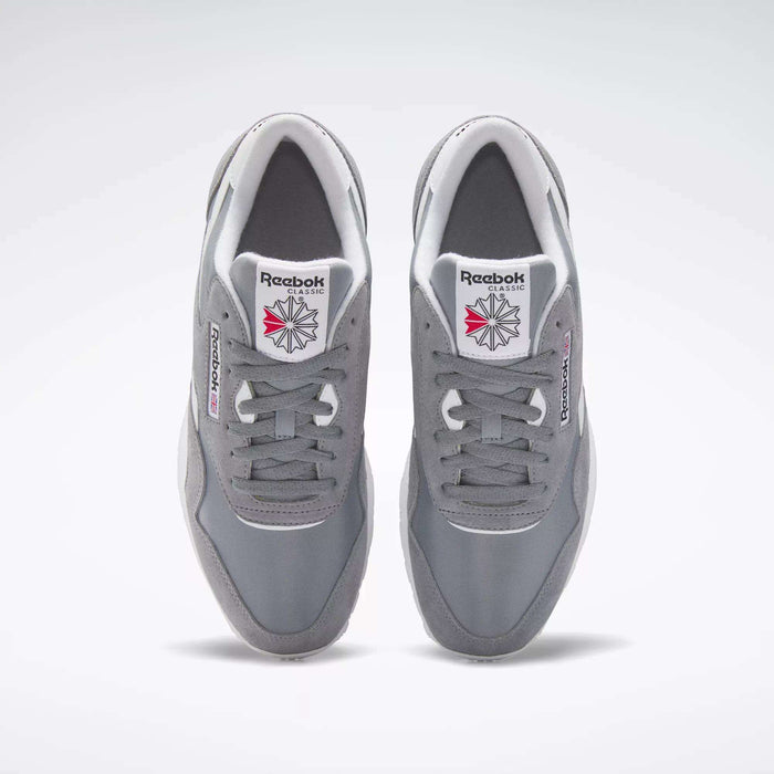 A pair of gray Reebok Men's Classic Nylon Shoes viewed from above, featuring nylon uppers, white soles and laces, plus red and gray Reebok logos on the tongues and sides—the perfect classic everyday sneakers.