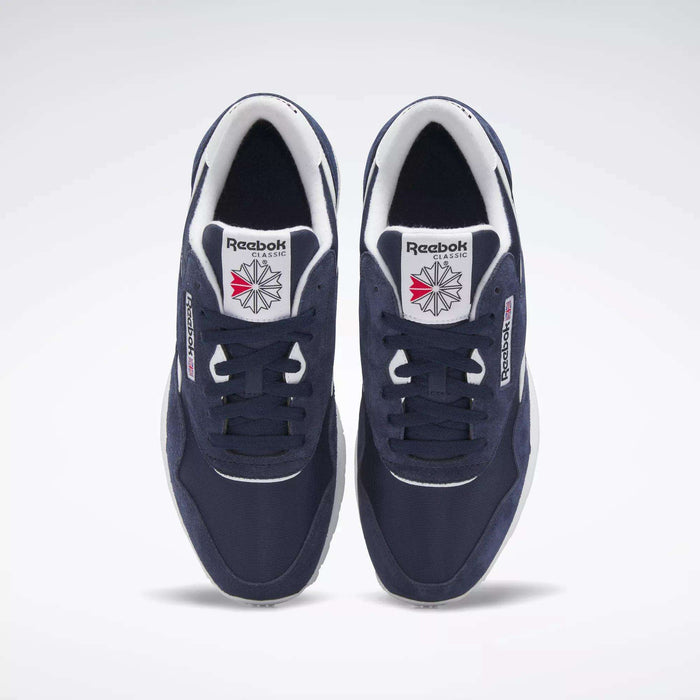 The Men's Classic Nylon Shoes by Reebok are navy blue sneakers with a nylon upper, white soles, and signature branding, shown from above against a plain white background.