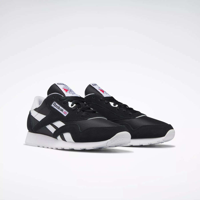Men's Classic Nylon Shoes by Reebok in black and white, featuring the iconic logo on the side and tongue plus white soles, shown on a plain white background—perfect everyday sneakers for effortless style.