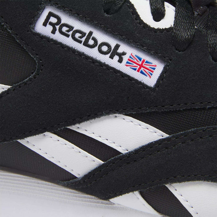 Close-up of a black Men's Classic Nylon Shoe by Reebok, featuring white stripes and the logo with the Union Jack flag on the side—ideal for fans of classic sneakers and everyday wear.