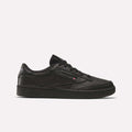 The Reebok Club C 85 Shoes feature a black leather upper, black sole, and black laces in a low-top design, shown in side profile on a plain white background.