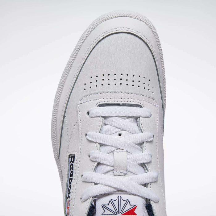 Close-up top view of Reebok Club C 85 Shoes, highlighting the white leather upper, laces, perforated toe box, stitched panels, and iconic Reebok logo—classic tennis-inspired style.