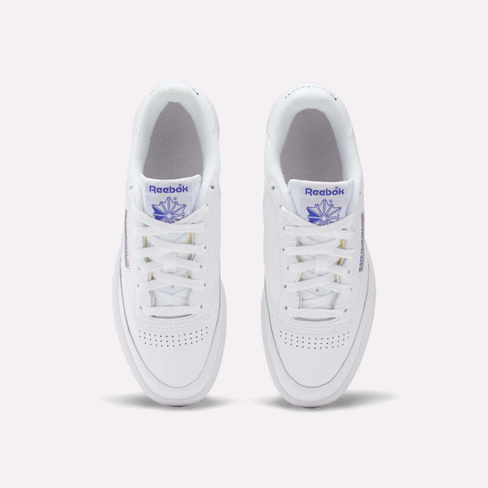 A top view of Reebok Club C 85 Shoes in white leather, featuring purple Reebok branding on the tongue and side, classic white laces, and perforated toe detailing for a timeless tennis-inspired style.