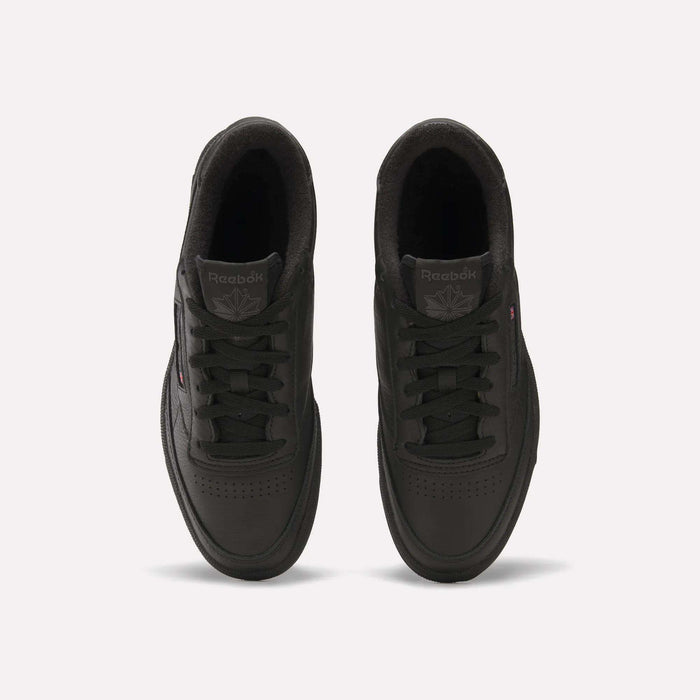 Top view of a pair of black Reebok Club C 85 Shoes with black laces, showing the Reebok logo on the tongue and a subtle side logo, placed on a plain white background.