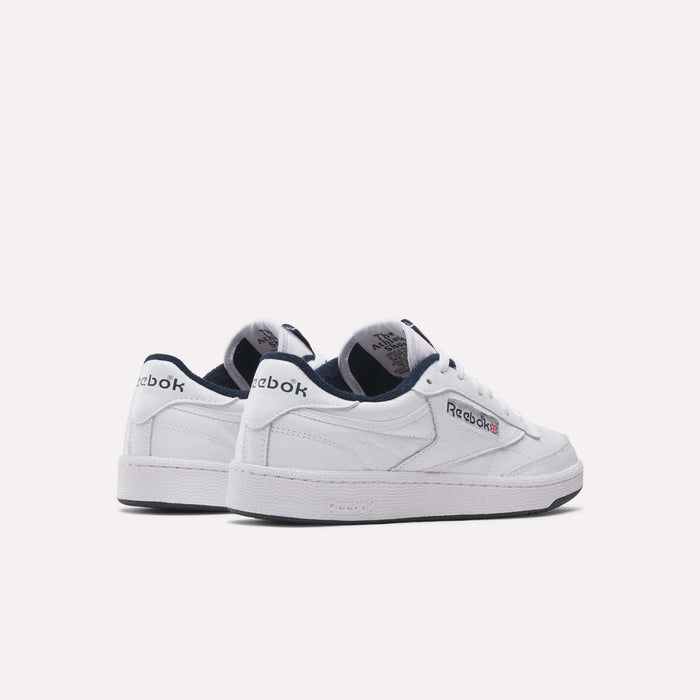 The Reebok Club C 85 Shoes are white leather sneakers with navy accents, a low-top classic design, and feature the Reebok logo on the side and heel. Shown against a plain white background, these shoes have tennis-inspired style.