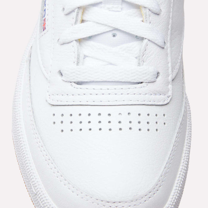 Close-up of the toe box and laces on Reebok Club C 85 Shoes, highlighting their textured leather upper, breathable perforations, and part of the rubber sole inspired by classic tennis style.