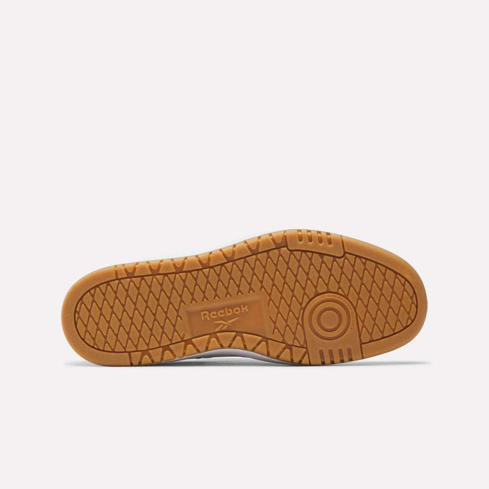 Brown rubber sole of Reebok Club C Double Shoes for big kids, featuring a textured geometric tread and center Reebok logo—perfect for girls’ leather upper styles.