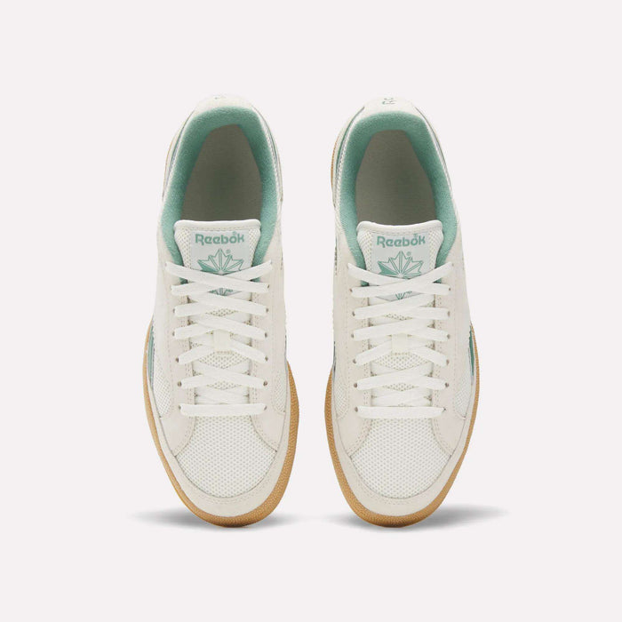 Top view of Reebok Club C Grounds 70 Shoes in white with mint green accents, white laces, and gum soles. Inspired by the '70s, these sneakers feature premium suede details and are displayed side by side on a plain white background.