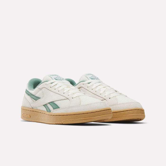 A pair of Reebok Club C Grounds 70 Shoes in off-white with mint green accents and a tan rubber sole, premium suede details, displayed side by side on a plain white background.