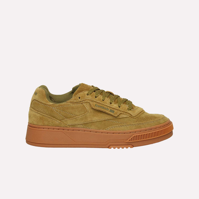 The Reebok Club C LTD Shoes feature tan suede uppers, tonal laces, subtle side branding, stitched detailing, and a light brown textured rubber sole for grip—a timeless lifestyle classic.