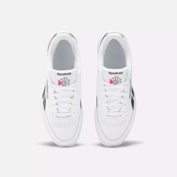 A top view of the Reebok Club C Revenge Shoes shows white trainers with black side accents and the Reebok logo in red and gray on each tongue.