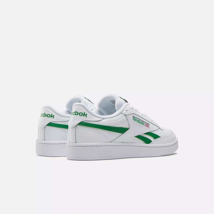 A pair of Reebok Club C Revenge Shoes is shown on a plain light background at an angle that highlights both the side and back, showcasing their classic white leather design with green accents and logos.