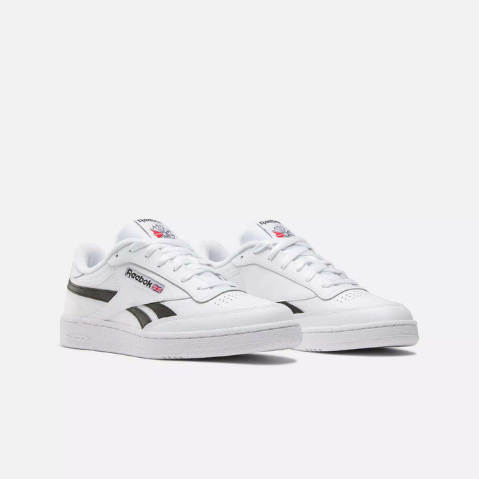 A pair of Reebok Club C Revenge Shoes in white, featuring black side stripes, red and blue logo accents, and white laces, displayed on a simple light background.