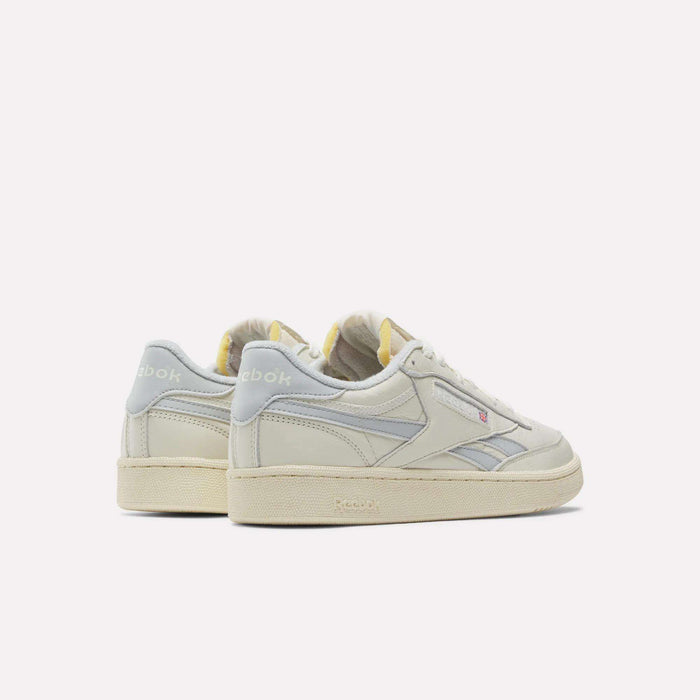 A pair of Reebok Club C Revenge Vintage Shoes in off-white with light grey accents and cream soles, made from full-grain leather, are showcased against a white background with both shoes angled to display the back and side views.
