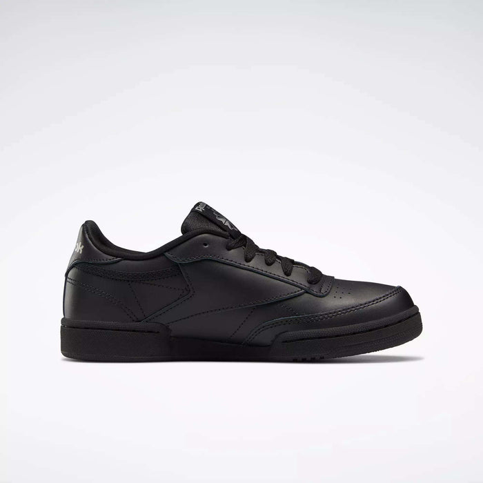 The Reebok Kids' Club C Shoes - Grade School is a black low-top sneaker with black laces, soft leather upper, and minimal branding, shown on a plain white background.