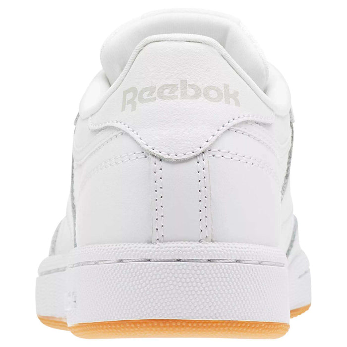 Rear view of white Reebok Kids' Club C Shoes - Grade School, with light brown high-abrasion rubber outsole, grey Reebok logo on the heel, and detailed stitching on soft leather uppers.