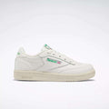 The Reebok Kids' Club C Shoes - Preschool are white sneakers with green accents and the Reebok logo on the side, inspired by classic '80s style, shown from the left against a plain light background.
