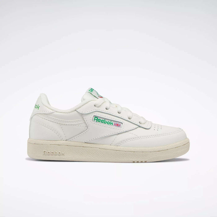 The Reebok Kids' Club C Shoes - Preschool are white sneakers with green accents and the Reebok logo on the side, inspired by classic '80s style, shown from the left against a plain light background.