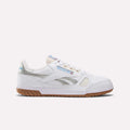 The Reebok Defiance 88 Shoes feature a white leather upper with silver metallic accents, blue Reebok branding, mesh panels on the side and toe, and a brown gum sole. Shown in side profile against a plain white background.
