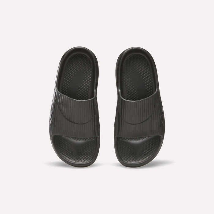 Reebok DMX Recovery Walking Slides in black, shown from above on a white background; feature wide ribbed straps, textured footbeds, and ultra-soft foam for comfort.