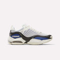 The Reebok DMX Series 3000 Shoes, shown in Chalk/Vector Blue/Black, feature a chunky sole and innovative DMX moving air technology for exceptional cushioning. Reebok branding stands out on the side of this athletic sneaker, displayed against a plain white background.