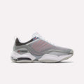 The Reebok DMX Series 3000 Shoes in Grey/White/Red feature mesh panels, white laces, a visible air-cushioned sole with DMX moving air technology for enhanced comfort, and subtle red accents. They are displayed on a plain white background.