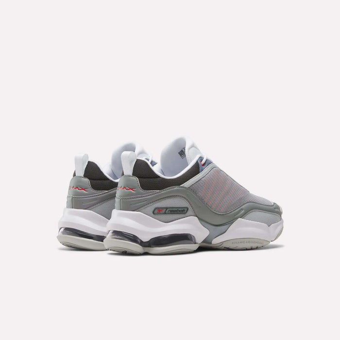 A pair of gray and white Reebok DMX Series 3000 Shoes with mesh uppers, thick white soles, and visible air cushioning are viewed from the back and side against a plain white background, combining classic comfort.