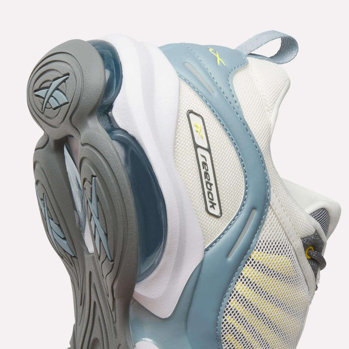 Close-up of the sole and side of Reebok DMX Series 3000 Shoes, showcasing a blue, white, and grey palette, mesh fabric, visible branding, and DMX moving air technology for added comfort.