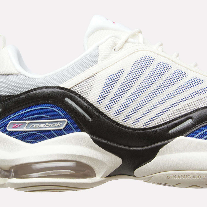 Side view of the Reebok DMX Series 3000 Shoes, featuring a white mesh upper with blue accents, black wave-style overlays, visible air cushioning powered by DMX moving air technology, and the Reebok logo on the side—ideal for those looking for stylish and cushioned footwear.