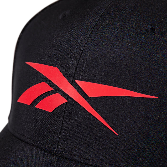 Close-up of the Reebok Elite Cap, a black hat with a red Reebok logo displayed on the front.