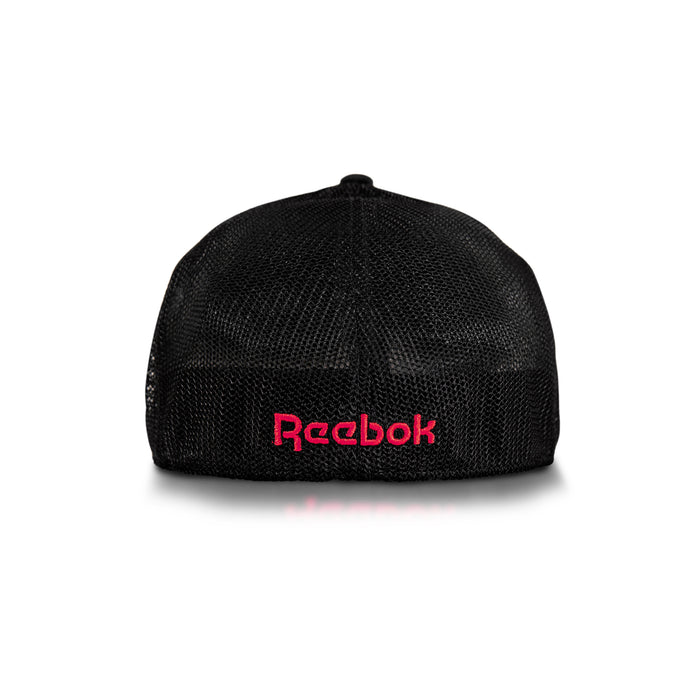 Elite Cap by Reebok shown from the back, features black mesh with the Reebok logo embroidered in pink near the bottom center. Displayed on a white background.