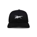 The Reebok Embroidered Vector Trucker Cap is shown from the front against a white background, featuring a black design with a white embroidered Reebok logo on the front.