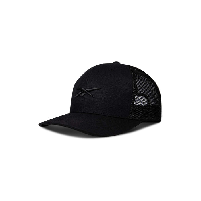 The Reebok Embroidered Vector Trucker Cap is black with a curved brim, mesh back panels, and a minimalist embroidered logo. Shown angled left on a plain white background.
