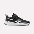 Displayed on a plain white background, the Reebok Energen Running Shoes - Little Kids in Black/White/Grey 3 feature a Velcro strap, pull tab at the heel, and a white sole with white accents—making them perfect for active little ones.