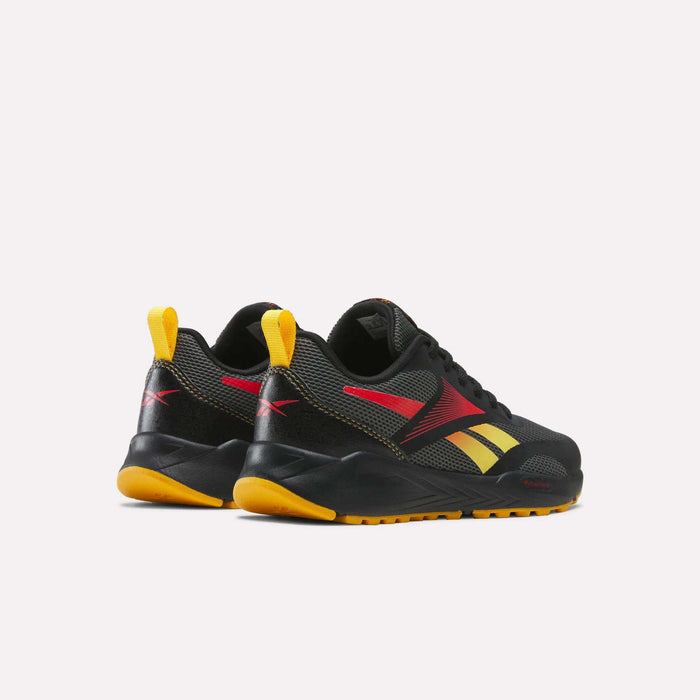 A pair of Reebok Energen Running Shoes for little kids in black with yellow and red accents, featuring yellow heel tabs and orange soles. These athletic shoes offer a cushioned midsole for extra comfort and are displayed at an angle to showcase the sides and backs against a plain white background.