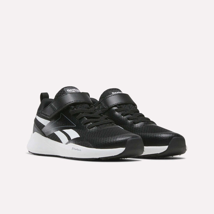 A pair of Reebok Energen Running Shoes for little kids, featuring a black design with white soles and signature side logos, laces, and a convenient velcro strap. Displayed against a plain white background, these stylish shoes combine comfort and performance—perfect for toddlers or young kids on the go.