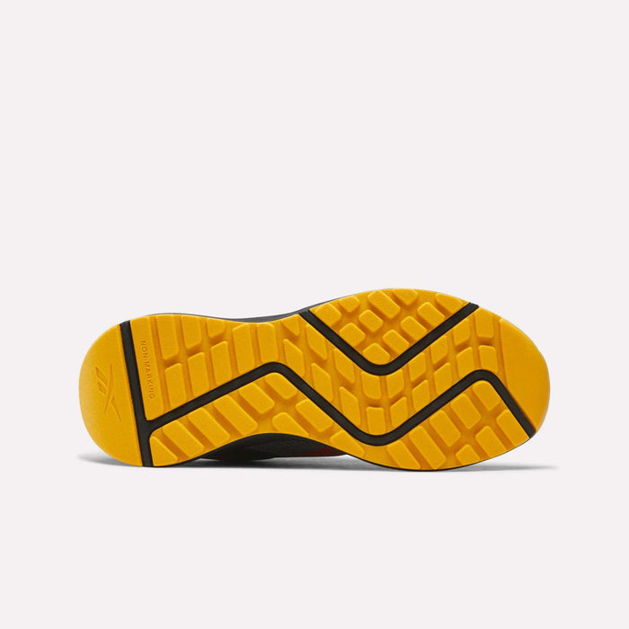 Bright yellow rubber outsole with black zigzag lines and a textured grip pattern, shown from the bottom on a light background—perfect for Reebok Energen Running Shoes for little kids, designed with a cushioned midsole for extra comfort.