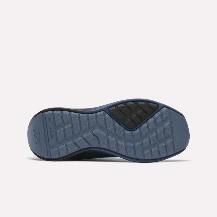 The image shows the sole of the Reebok Energen Running Shoes for little kids in blue, featuring a textured tread pattern and a black section near the top. The Reebok logo appears on the left side of the sole.