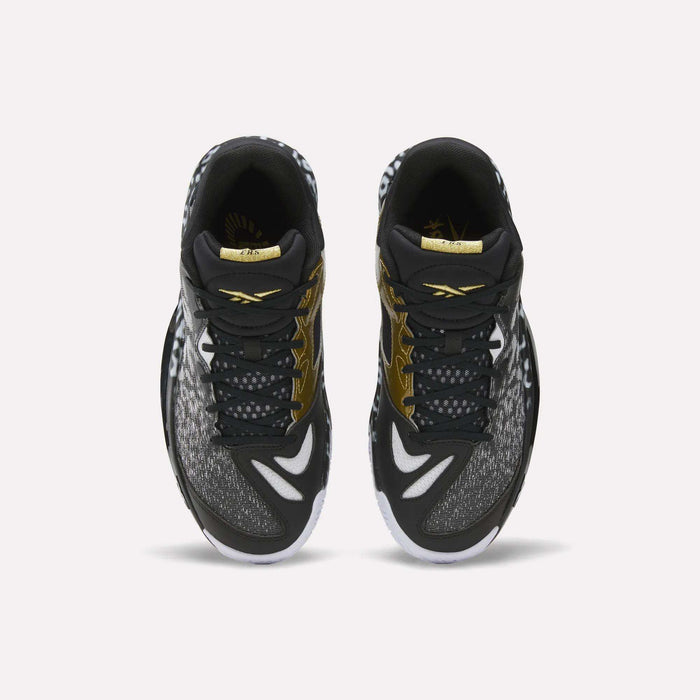 Top view of a pair of Reebok Engine A 26 Basketball Shoes in black with white and gold accents, featuring patterned toe and side panels, white outsoles, and ERS+ System cushioning for game-changing comfort.
