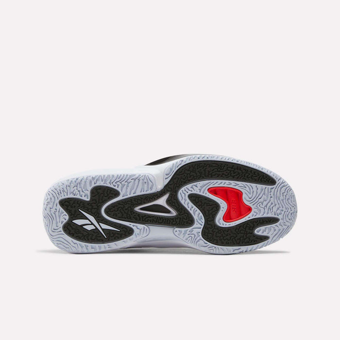 The image shows the sole of the Reebok Engine A 26 Basketball Shoes, featuring a wavy black, white, and red pattern with a prominent Reebok logo and textured grip—ideal for players seeking speed on the court.