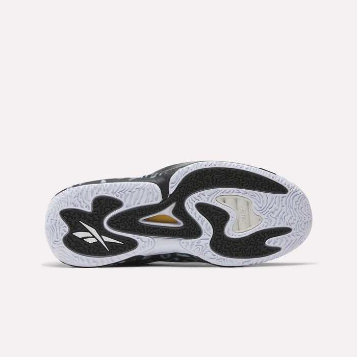 The image shows the sole of the Reebok Engine A 26 Basketball Shoes, with a wavy black and white pattern, textured grip, and a gold accent near the midfoot. The Reebok logo highlights their lightweight support for peak performance.