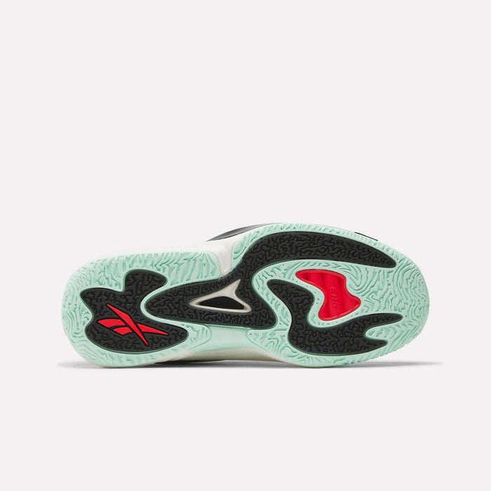 The image displays the sole of Reebok Engine A 26 Basketball Shoes, featuring a light green textured pattern for stability, black and white abstract shapes, a red accent, and the Reebok logo in red and black.
